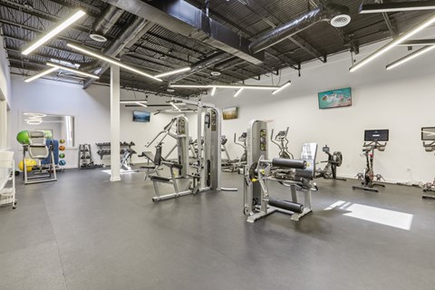 the gym at the community center with weights and exercise equipment