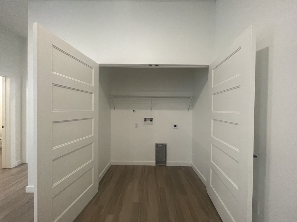 a room with white walls and a wooden floor