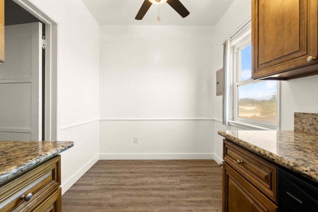 a kitchen with a refrigerator and a window