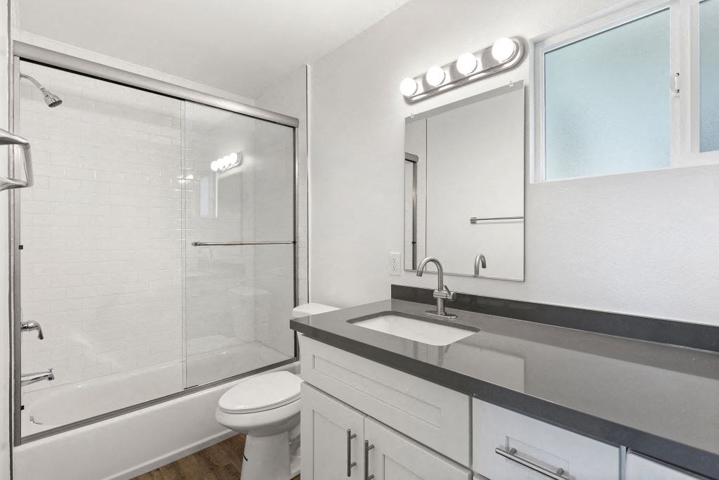 a bathroom with a sink and a shower