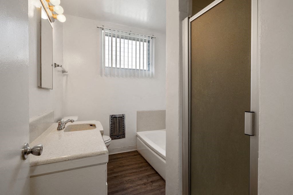 a bathroom with a toilet sink and bathtub