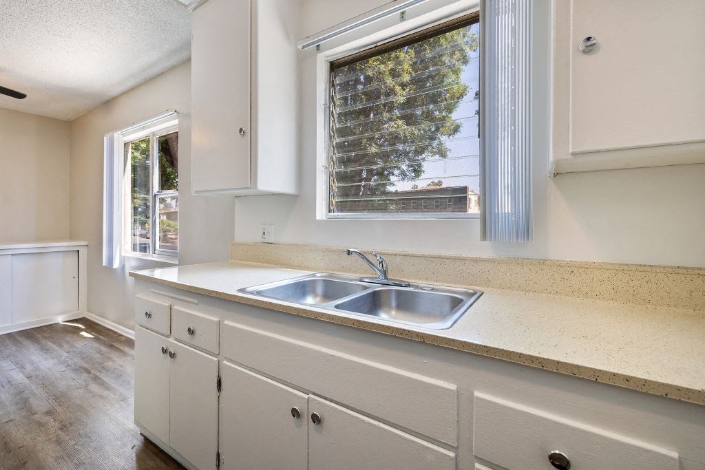 a kitchen with a sink and a window
