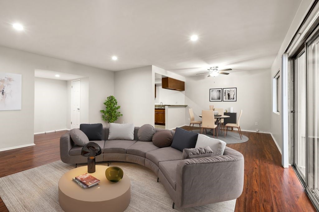 A living room with a grey sofa and a coffee table.