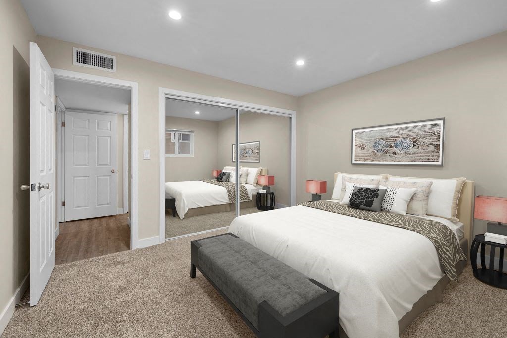a bedroom with a bed and a mirror at Lombardi Apartments, Woodland Hills, CA, 91367