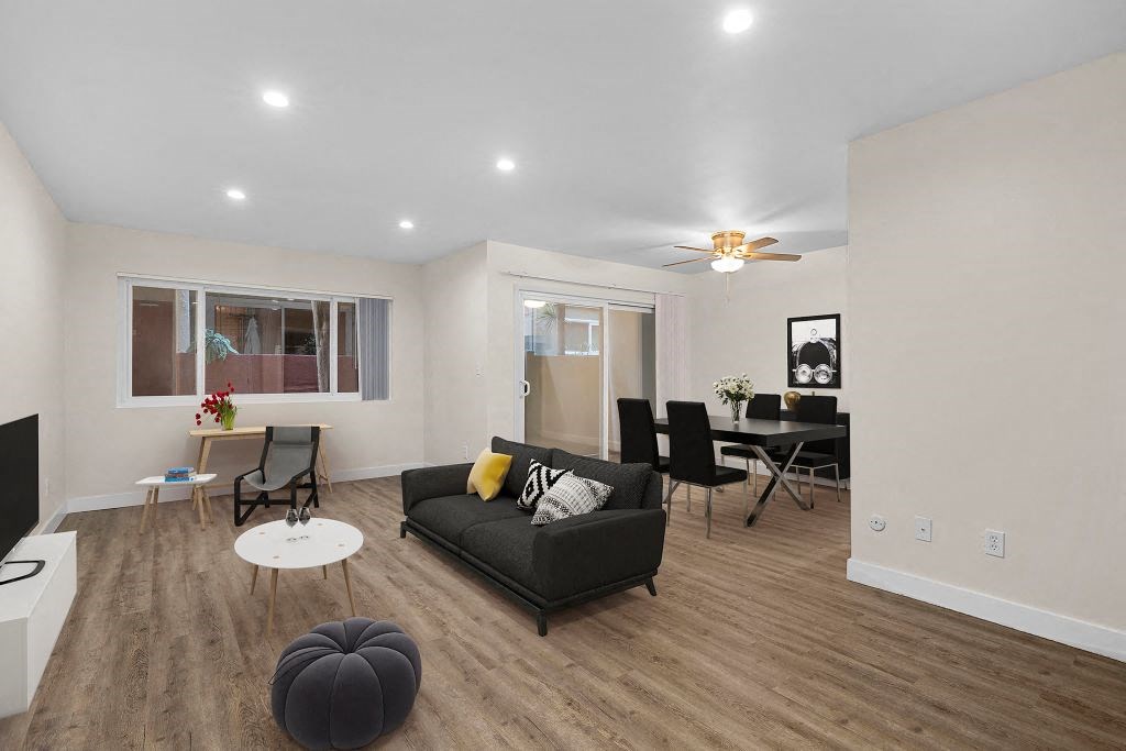 a living room with a couch and a table at Lombardi Apartments, Woodland Hills, CA