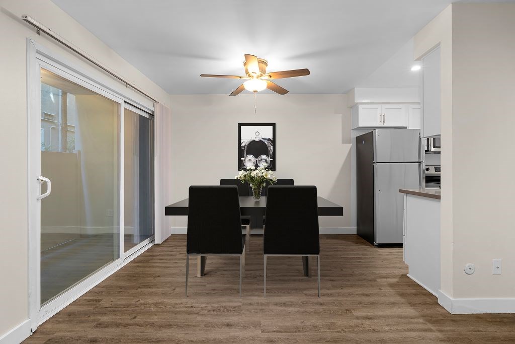 a dining room with a table and chairs