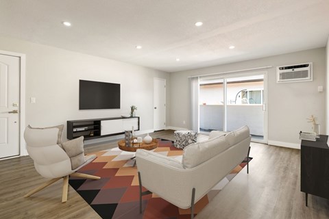 A modern living room with a white sofa and a television.