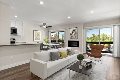A modern living room with a white couch and a black coffee table.