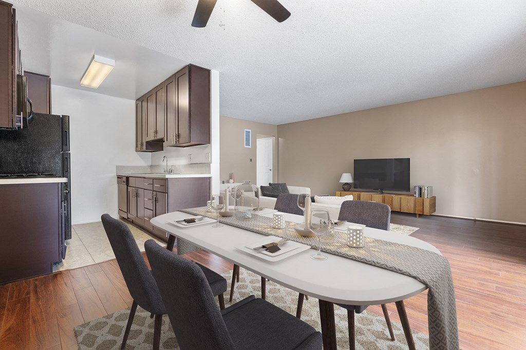 an open living room and dining room with a table and chairs