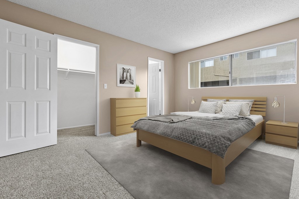 a bedroom with a bed and a window