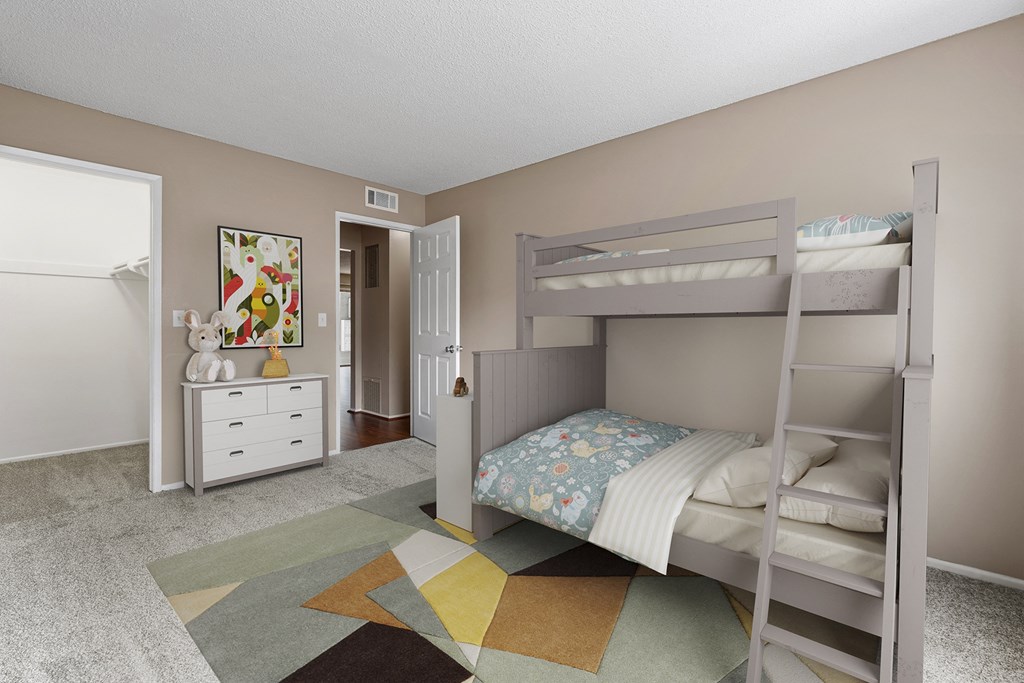 a kids bedroom with bunk beds and a large rug