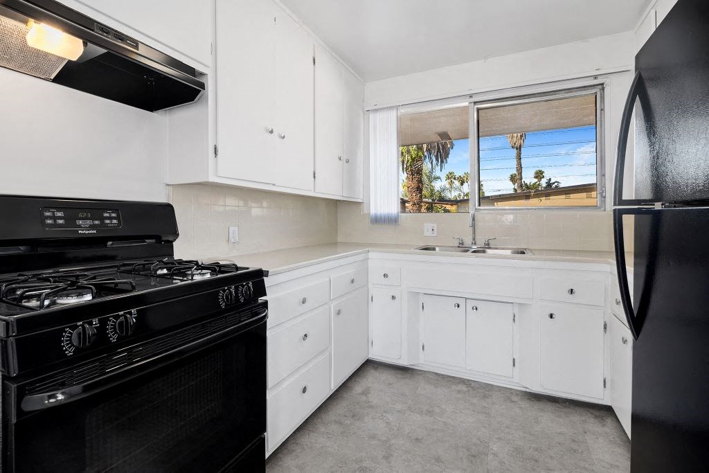 Kitchen with updated cabinets and all black appliances