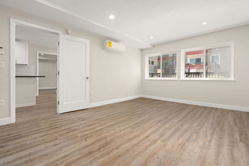 Primary Bedroom with Wood Floors at Woodland Trio Apartments, California, 91601