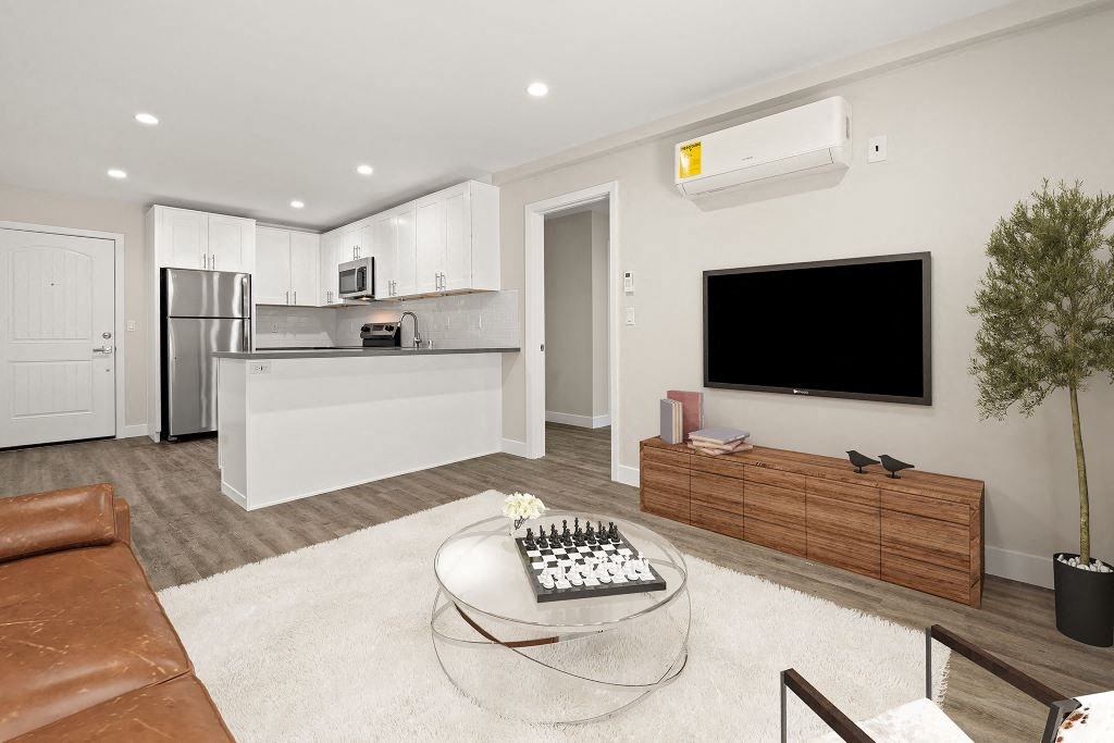 Living Room With TV at Woodland Trio Apartments, California, 91601