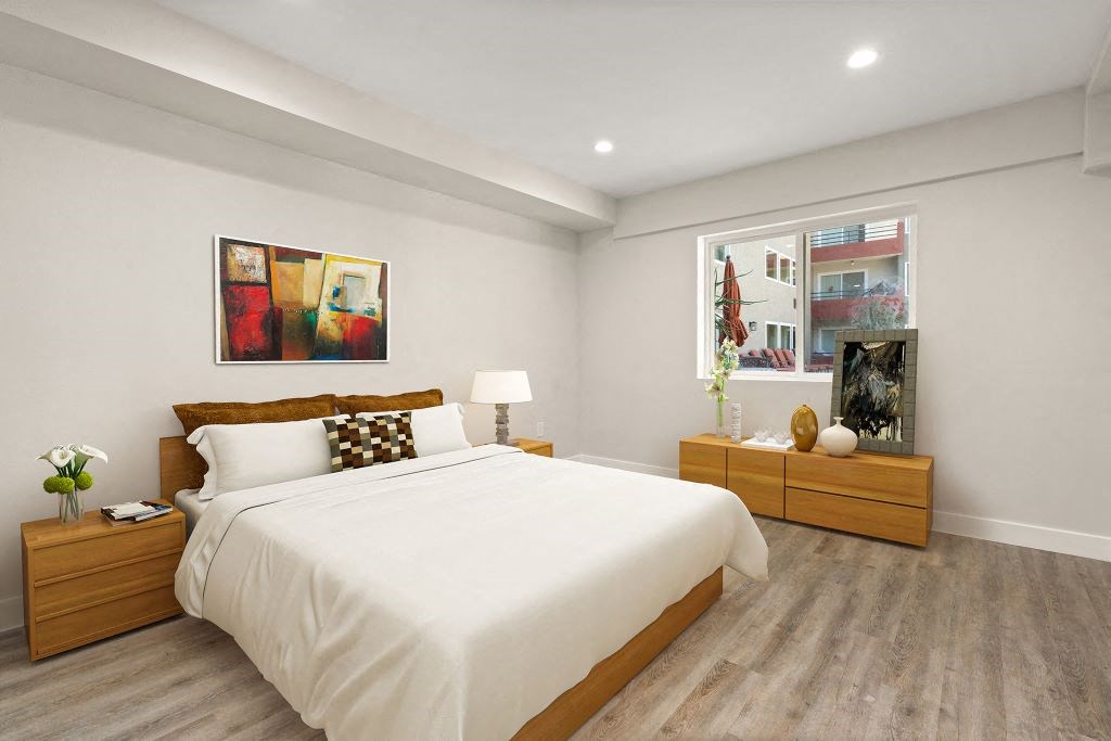 a bedroom with a bed and two dressers at Woodland Trio Apartments, North Hollywood, 91601