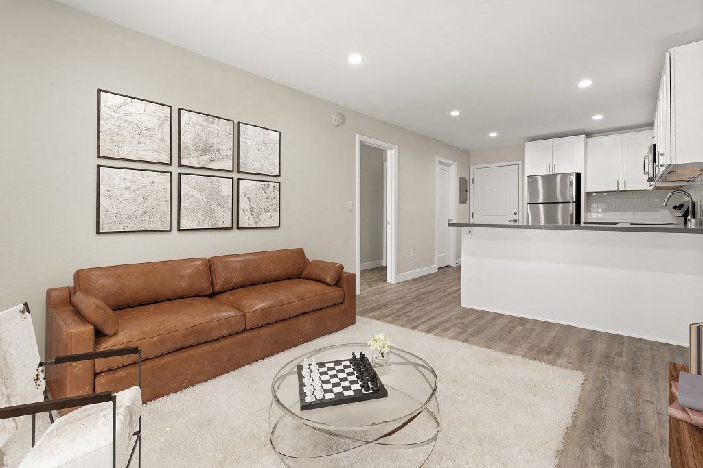 Living Area With Kitchen at Woodland Trio Apartments, California