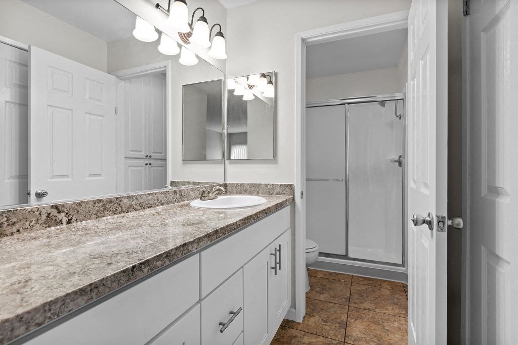 a bathroom with a sink and a toilet at The Meadows at Westlake Village Apartments, CA, 91361