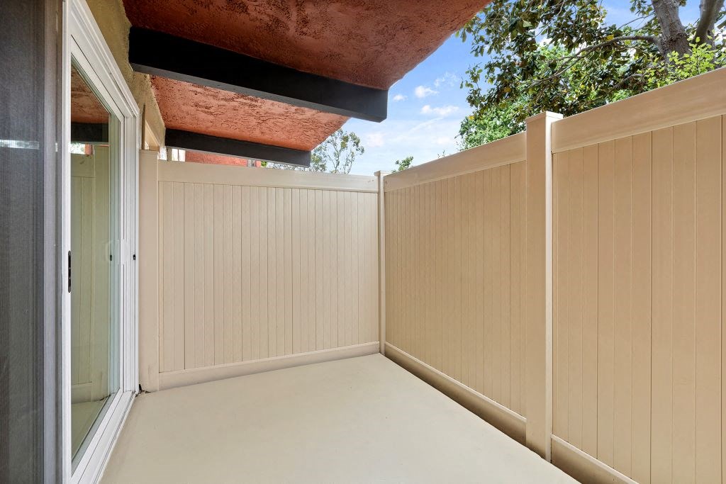 a porch with a fence and a blue sky in the background  at The Meadows at Westlake Village Apartments, CA, 91361