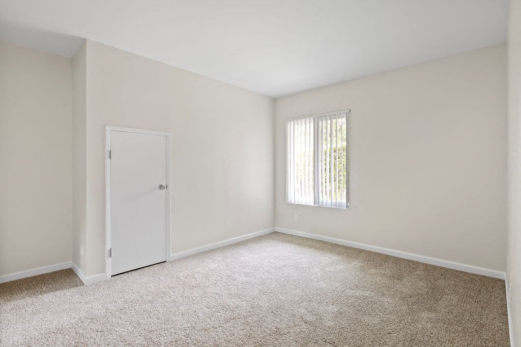 a bedroom with white walls and carpet at The Meadows at Westlake Village Apartments, Westlake Village, CA 91361