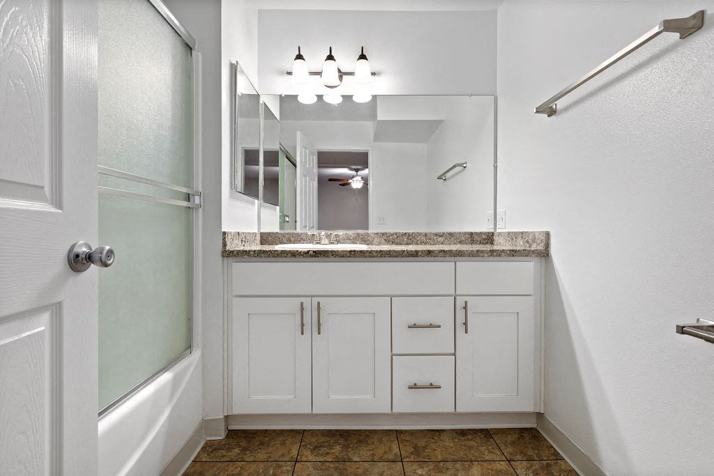 a bathroom with a sink and a mirror at The Meadows at The Meadows at Westlake Village Apartments, Westlake Village, CA