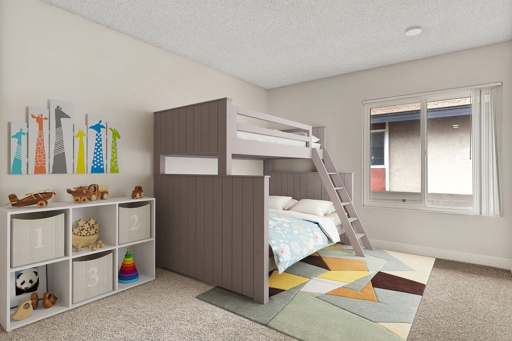 A child's bedroom with a bunk bed and a ladder.