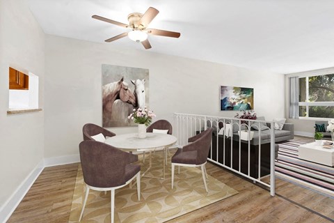 a living room filled with furniture and a ceiling fan at Parkway Plaza Apartments, California, 90230