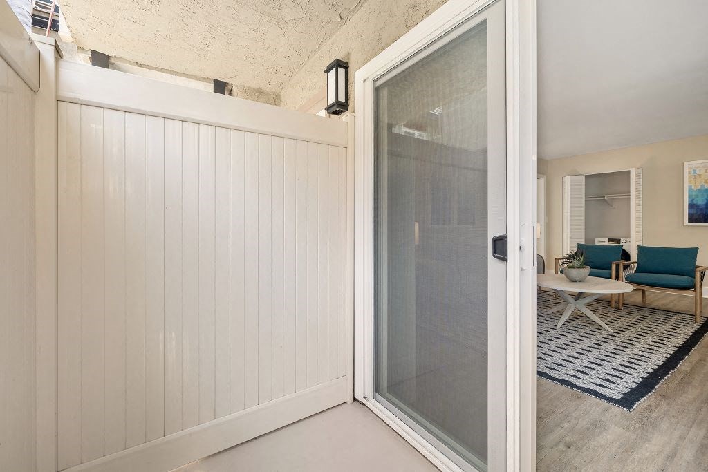 an open door leading to a living room with a couch and coffee table in the background at Casa De Marina Apartments, Los Angeles, CA 90066