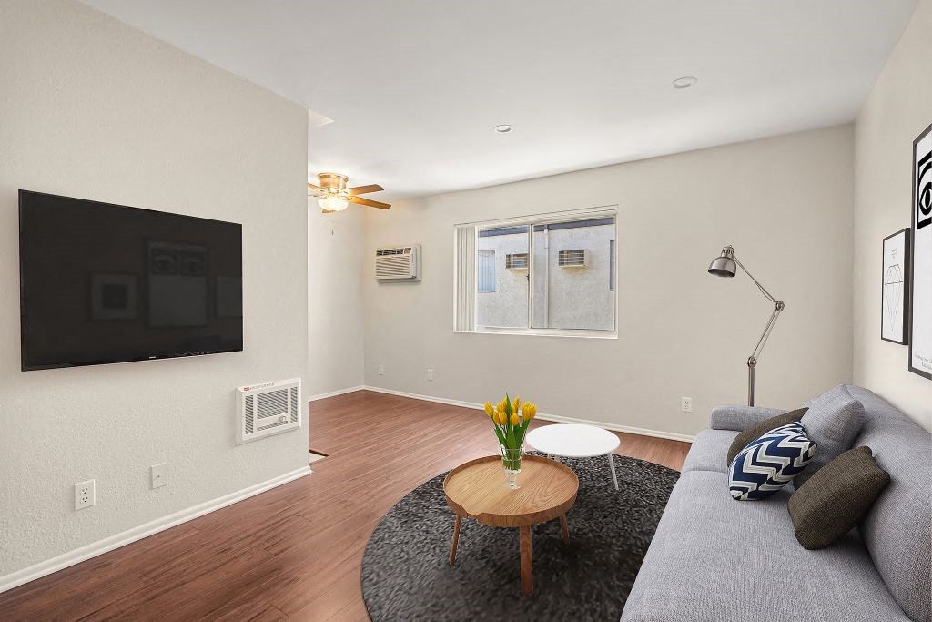 Living Room With TV at Topanga Canyon Apartments, West Hills