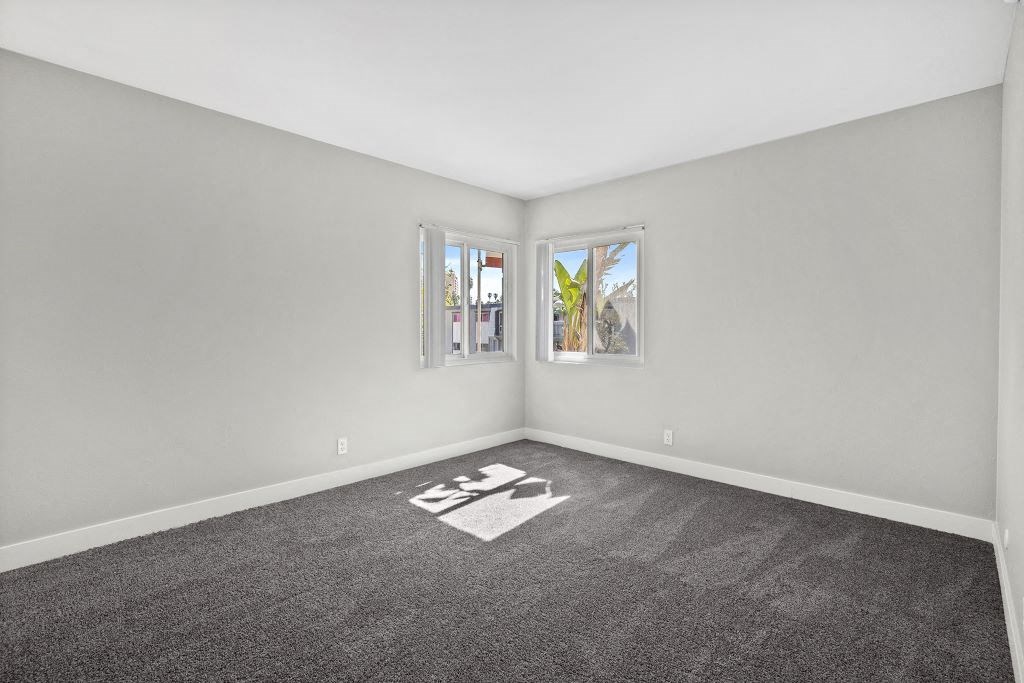 wall to wall carpet, stylish decor, and white walls at The Reserve at Warner Center, Woodland Hills, California