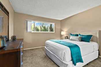 a bedroom with a bed and a dresser and a window at Vista Apartments, Mar Vista, CA