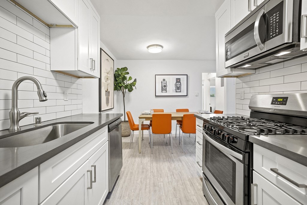 Kitchen with Stainless Steel Appliances and Updated Countertops and Cabinets at Kling Trio Apartments, California