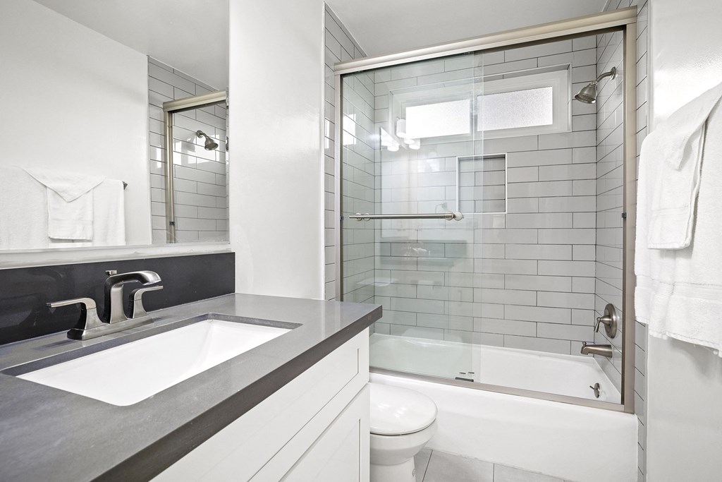 Bathroom with Subway Tile and Updated Counters and Cabinets at Kling Trio Apartments, Valley Village, CA