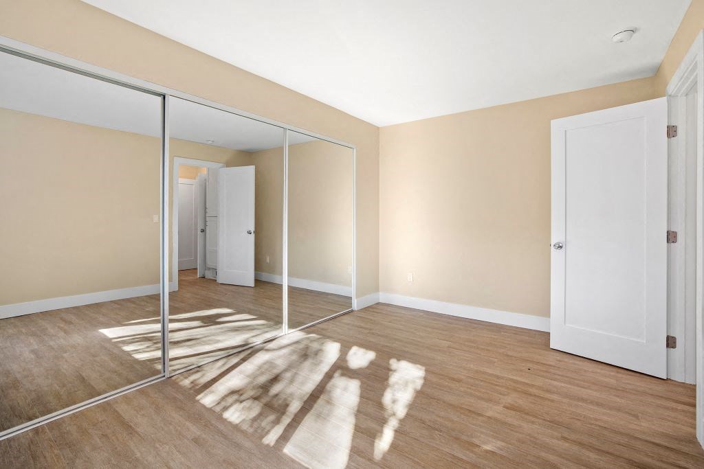 bedroom with mirrored closet at Casa De Marina Apartments, Los Angeles, CA
