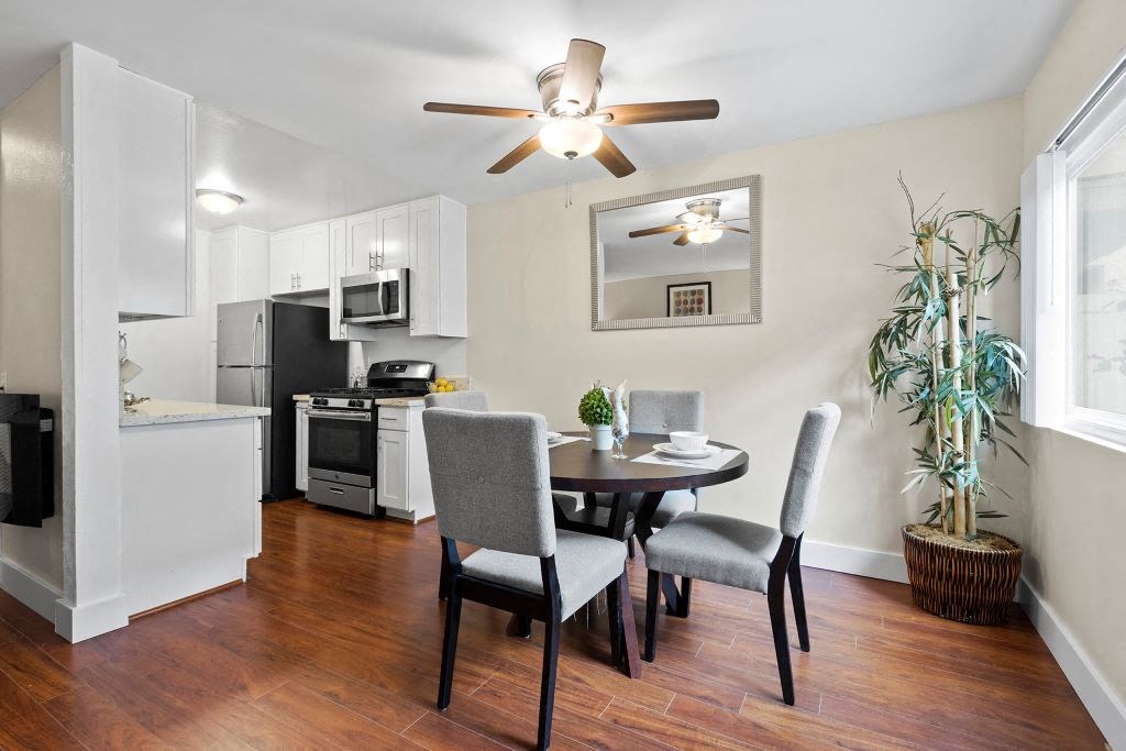 Dining Room with Circle Table, Ceiling Fan, and Decorative Table Setting at Casa De Marina Apartments, Los Angeles, 90066