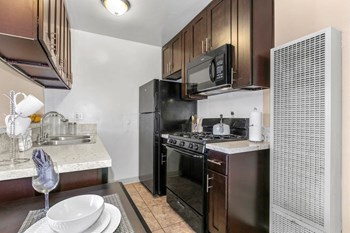 Valley Village CA Apartments for Rent - Fully Equipped Kitchen with Convenient Amenities Such as Fridge, Microwave, and Stove - Photo Gallery 3