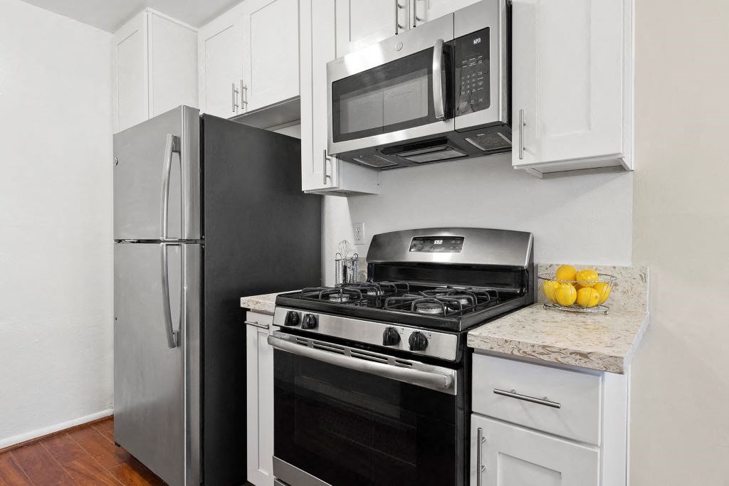 Kitchen with Granite-Style Countertops and Stainless Steel Appliances at Casa De Marina Apartments, Los Angeles, CA 90066