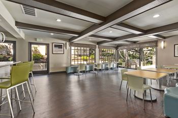 A room with a long table and chairs.