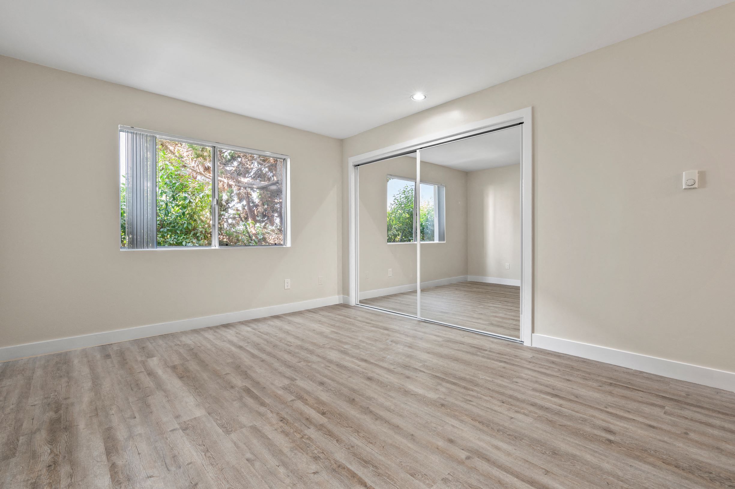 Culver City Aparments Bedroom with Hardwood Flooring and Natural Light