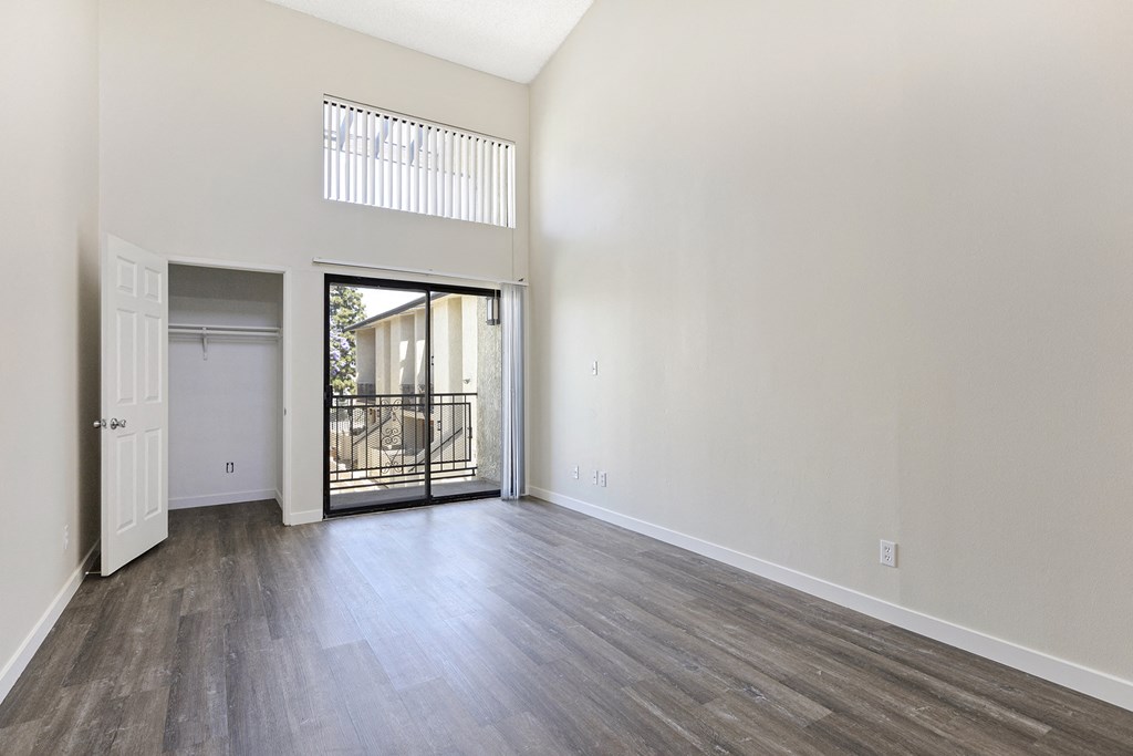 Living Room with Balcony and Wood Floors