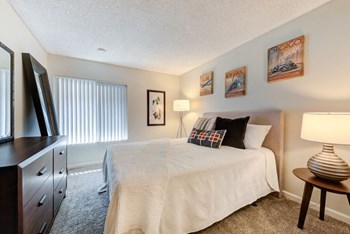 One Bedroom Apartments in Westlake Village, CA - The Meadows at Westlake Village Bedroom with Plush Carpet Flooring and Large Window - Photo Gallery 5