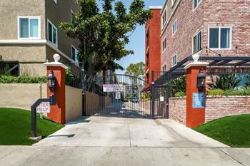 A gated entrance to a building with a sign that says "CAN'T ENTER".