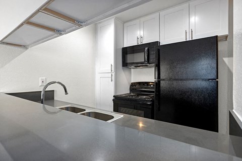 Kitchen with Updated Cabinets and Countertops Kitchen with Updated Cabinets and Countertops at Topanga Canyon Apartments, West Hills, California