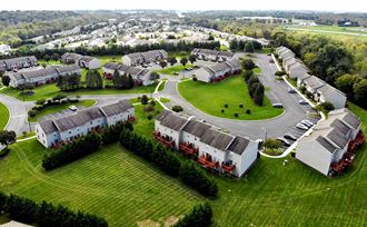 an aerial view of a neighborhood with houses and lawn