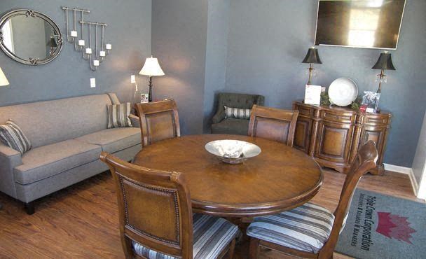 a living room with a table and a couch