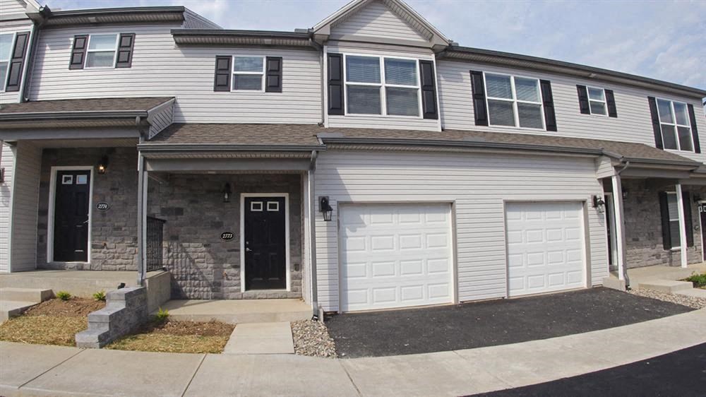 a white house with a white garage door