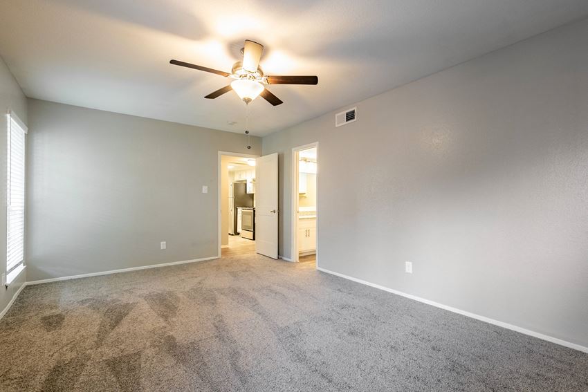Renovated bedroom with ceiling fan