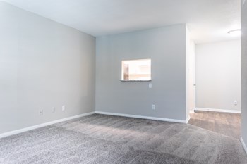 a bedroom with gray walls and a gray carpet