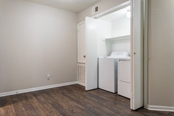 a small laundry room with a washer and dryer - Photo Gallery 6