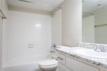 a bathroom with a sink toilet and bathtub - Photo Gallery 12