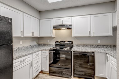 Kitchen with new appliances at The Life at Highland Village, Missouri, 64129
